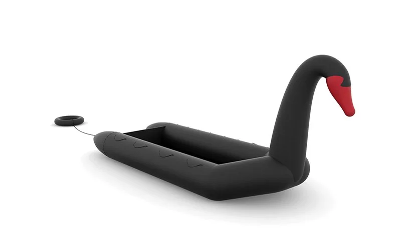 vacances contre immigration: les concepteurs fusionnent un bateau de réfugiés avec un cygne gonflable designboom