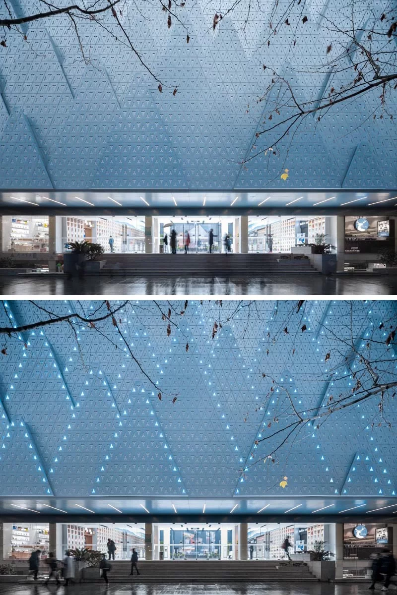 Des couches de plaques d'aluminium perforées en forme de montagnes ont été conçues pour créer un arrière-plan pour les arbres de la rue et symboliser la nouvelle vie de la librairie de langues étrangères du Hubei. #Architecture #FacadeDesign #BuildingDesign