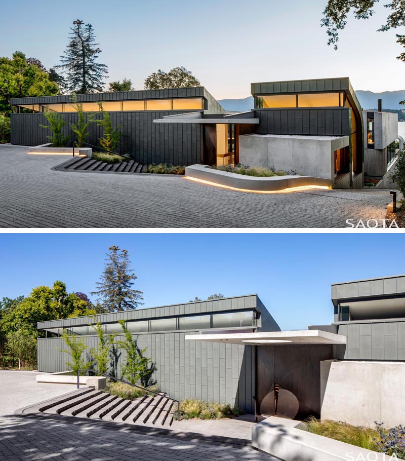 L'extérieur de cette maison moderne présente un revêtement en zinc, tandis que l'éclairage de nuit montre les lignes de la maison et guide les visiteurs vers la porte d'entrée. #ZincCladding #ModernHouse #ModernArchitecture