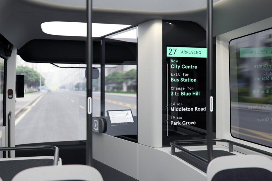 rendu de l'intérieur du bus avec grand écran montrant différents arrêts