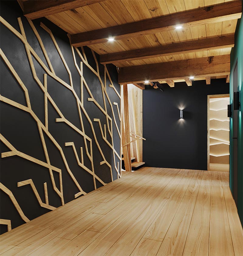 Fabriqué à partir de morceaux de bois individuels, ce mur d'accent en bois de type branche moderne crée un point focal dans la pièce et complète les autres détails en bois. #WoodAccentWall #BlackWall #BranchArt #AccentWallIdeas #BlackAccents