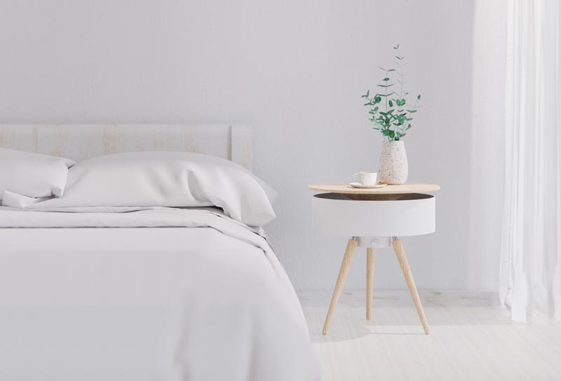 Une table de chevet moderne en bois et blanc.