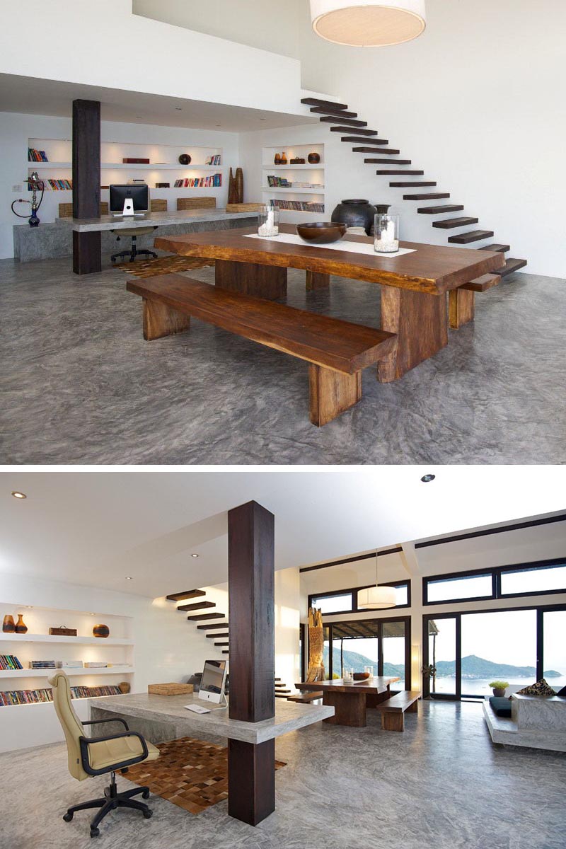 Un bureau en béton personnalisé utilise une colonne en bois comme support dans ce bureau à domicile.