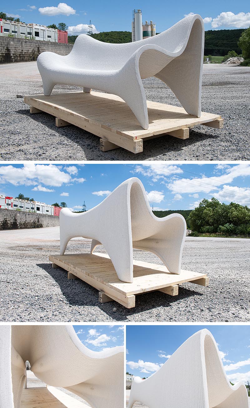 Un canapé d'extérieur imprimé en 3D en béton blanc.