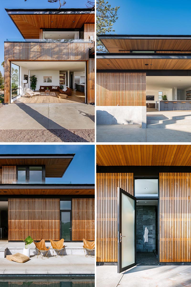 Une maison avec un parement à lattes de bois s'ouvre sur les espaces extérieurs et est accentuée par des détails noirs comme les cadres de fenêtres.