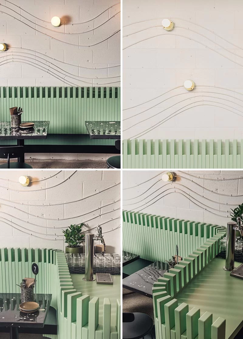 Des conduits électriques et des luminaires sans clé ont été utilisés pour créer un art mural attrayant qui trace légèrement la forme d'une vague.